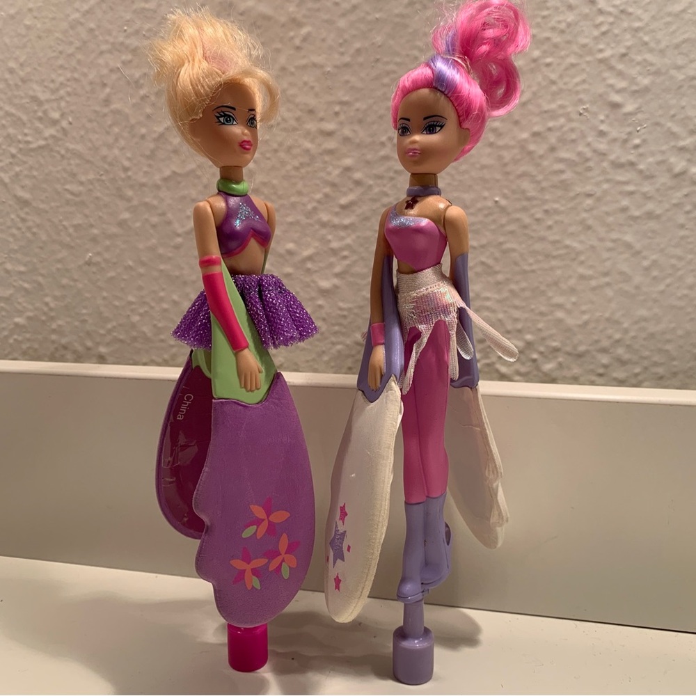 Two Sky Dancer dolls with launcher base